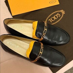 Tod's Black Leather Loafers with Gold Accent